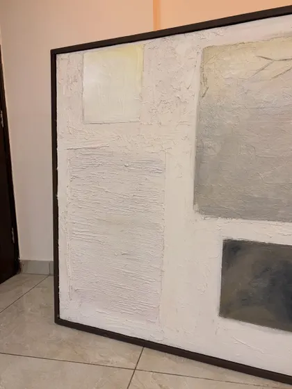 The finished 4ft x 4ft textured artwork, framed and ready to go. The dark frame provides a sharp contrast to the white and grey tones of the abstract composition.