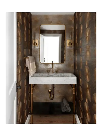 To step up the glam quotient, I used this 'Parasol Stitch' wallpaper with a muted gold and bronze finish. It adds texture, warmth, and a touch of metallic luxury to this elegant powder room.