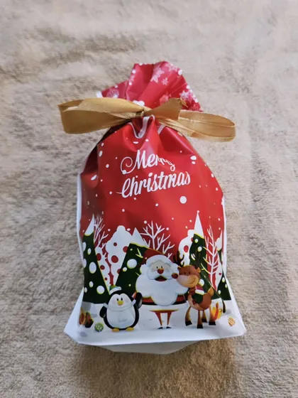 A festive Christmas potli, a great budget-friendly option for gifting chocolates.