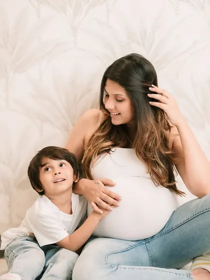 A duplicate of a previous image, showing the sweet bond between mother and son during a maternity shoot.