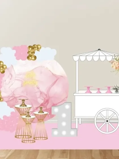 A mockup for a delicate and dreamy first birthday, featuring a watercolor-style backdrop, a candy cart, and gold accents.