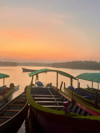 Boats resting at the dock during sunset in Honnavar. A peaceful end to the day.