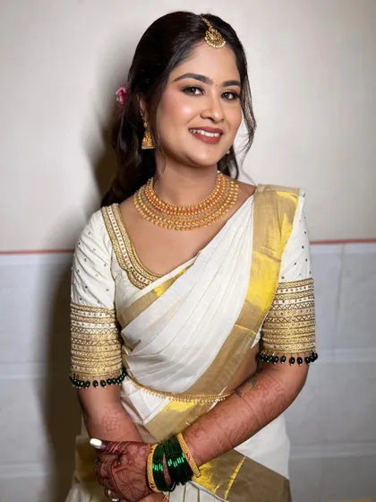 Another angle of the complete look, showing how the soft glam makeup works beautifully with the traditional jewelry and attire.