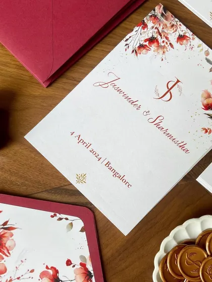 A closer look at the details from this beautiful wedding suite. The design included multiple inserts with event details, custom floral envelope liners, and a personalized wax seal with the couple's initials.