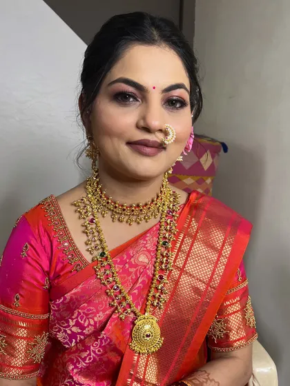 A full portrait of the client, looking stunning in her traditional attire.