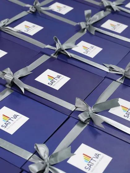 Custom hampers created for Sattva. The deep blue boxes with the company's logo and a silver ribbon make for a striking and memorable corporate gift.