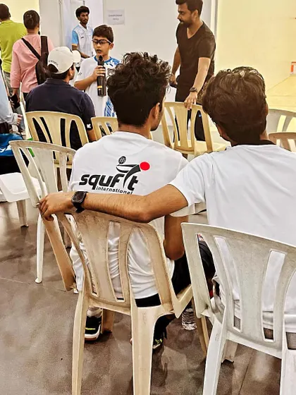 The team watching and supporting their teammates from the sidelines at the Sunil Verma Memorial Squash Championship. We win and lose as one.