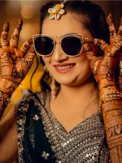 A fun close-up of the stylish bride and her intricate henna.
