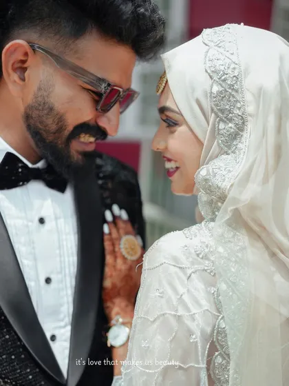 A beautiful close-up of the couple, highlighting the bride's stunning smile and the groom's dapper look.