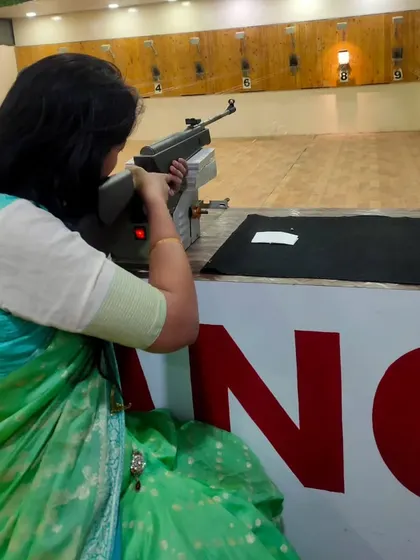 A great view from the shooting lane. This shooter is demonstrating focus and proper form during her session with an air rifle.