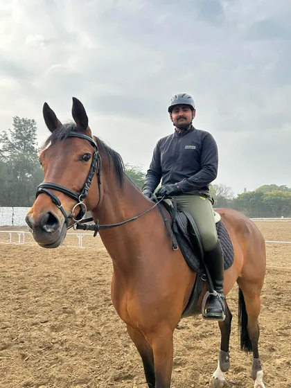 A rider and his horse, Castell Gandolfo, share a quiet moment in the training arena. We believe the partnership between horse and rider is the most important part of the sport.