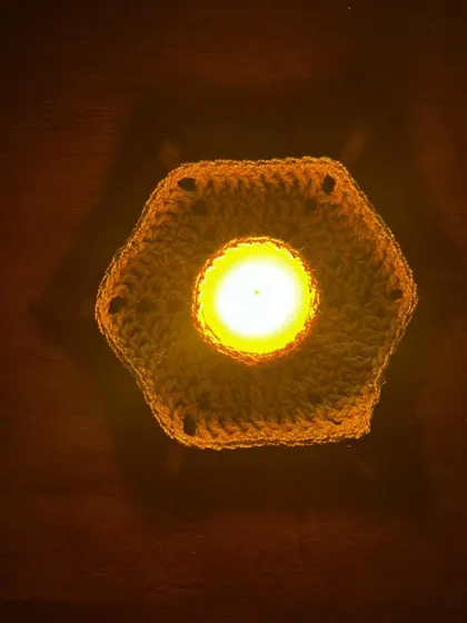 Another angle of the hexagonal tea light holder, showing its simple, clean design.