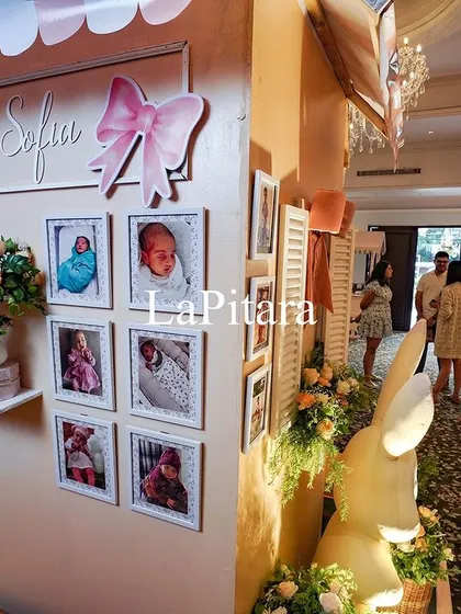A personalized photo wall designed like a little house, showcasing pictures of the birthday girl, Sofia.