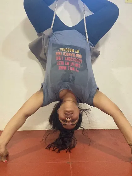 Using props like wall ropes is a key part of my teaching method for advanced poses. Here you can see my students in an inverted Baddha Konasana (Bound Angle Pose), using the ropes to decompress the spine and open the hips safely.