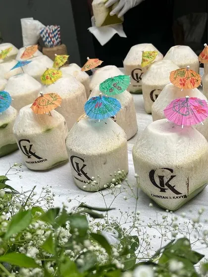 Personalized coconuts with the couple's initials, a small but thoughtful detail that adds a unique touch to the guest experience.