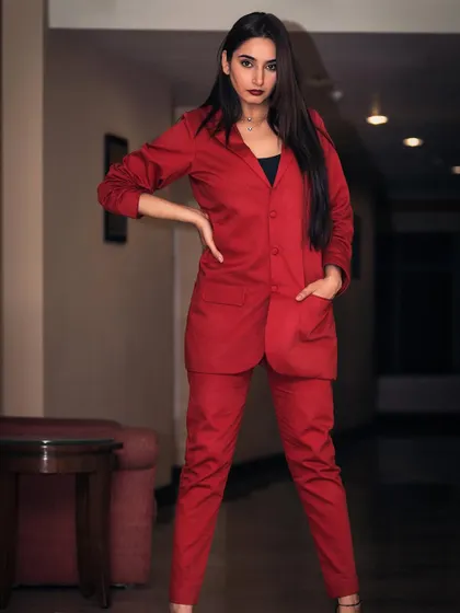 A powerful portrait of Ragini Dwivedi for her brand ambassadorship announcement. The red blazer and direct gaze convey confidence and professionalism, perfect for corporate and commercial campaigns.