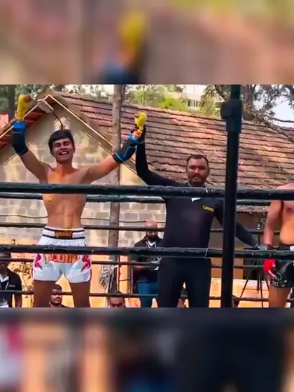 Victory is sweet. Our fighter celebrates his win in the ring, a moment earned through discipline and relentless training in our competitive program.