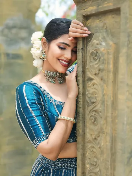 A close-up portrait that showcases the soft, romantic makeup look. The focus is on glowing skin and a happy, serene expression.