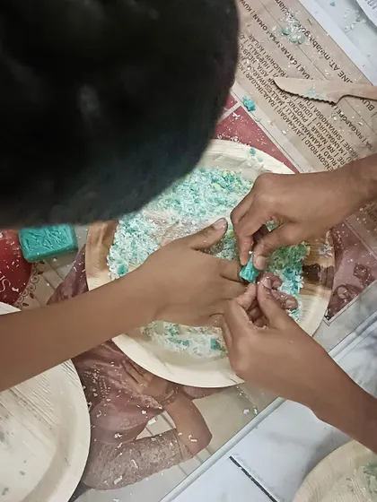 Inspired by the intricate carvings of Karnataka's temples, children get hands-on with a soap carving activity, carefully scraping and shaping their own designs.