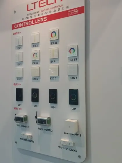 A display of intelligent lighting controllers, including DMX, BLE, and WiFi-enabled switches for smart home and commercial automation.