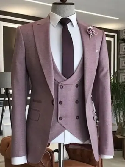 This three-piece suit in a textured mauve or onion pink is a very subtle and sophisticated option. The fabric has a beautiful texture that adds to its appeal.