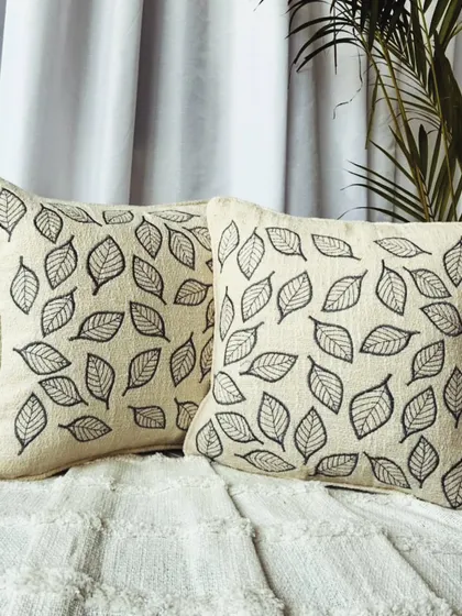 A simple yet elegant cushion cover featuring an all-over leaf embroidery pattern. This design is perfect for creating a calm, nature-inspired atmosphere.