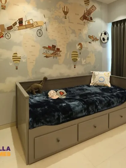 The daybed in the adventure-themed room comes with large pull-out drawers, providing plenty of storage for toys and clothes.