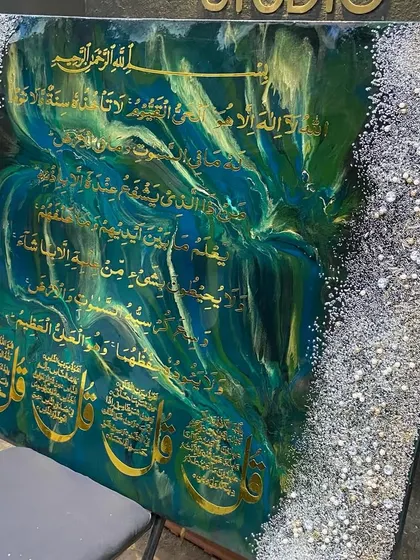 A side angle of the emerald and sapphire artwork, showing how the colors shift in the light.