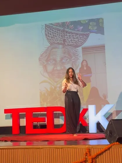 Another angle from my TEDx talk, with the image of an elder woman from my travels serving as the backdrop and inspiration for my stories.
