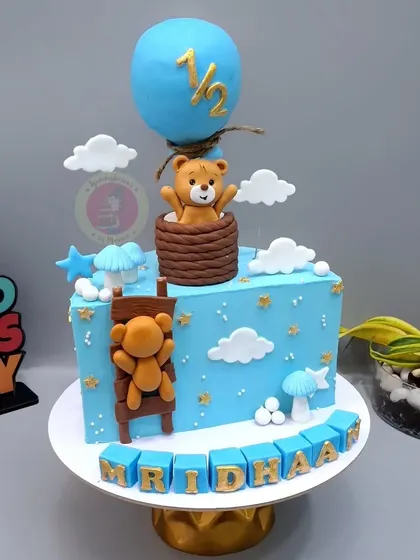 A teddy bear hot air balloon themed half-birthday cake. This is one of our most popular designs for the six-month mark.