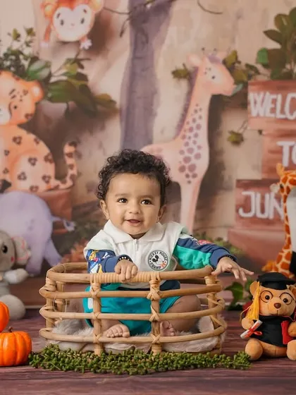 Welcome to the jungle! This is an example of a fun, themed studio session for a baby, complete with a custom backdrop and adorable animal props.