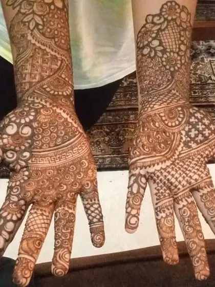 A delicate yet full design that covers both hands, perfect for any celebration.