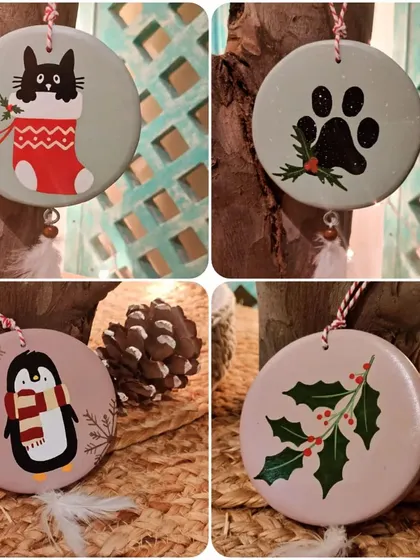 For the animal lovers, our Christmas ornament collection includes cute cats in stockings, festive paw prints, and sweet penguins to adorn your tree.