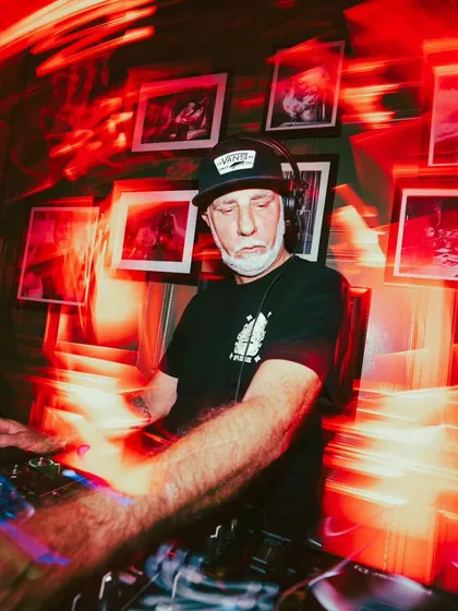 The DJ booth is the command center for the night's vibe.