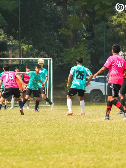 A header attempt during a corner kick, a chaotic and exciting moment in the penalty box.