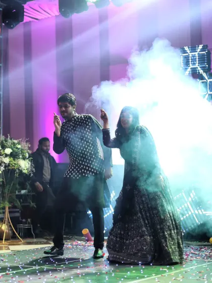 A snapshot of a couple lost in the music on their sangeet night. We focus on creating moments where you can just enjoy the dance and each other.
