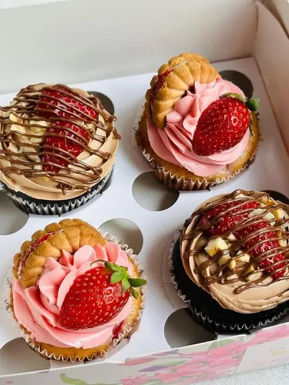 A fun and fruity assortment of cupcakes. This box features my Jimjam strawberry and Nutella Strawberry cupcakes, both topped with fresh strawberries for a burst of flavor.