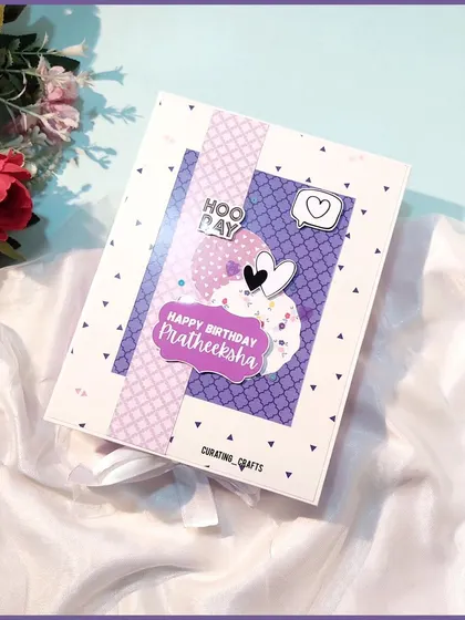 A closer look at the cover of the personalized birthday scrapbook for Pratheeksha. The layered elements give it a lovely 3D effect.