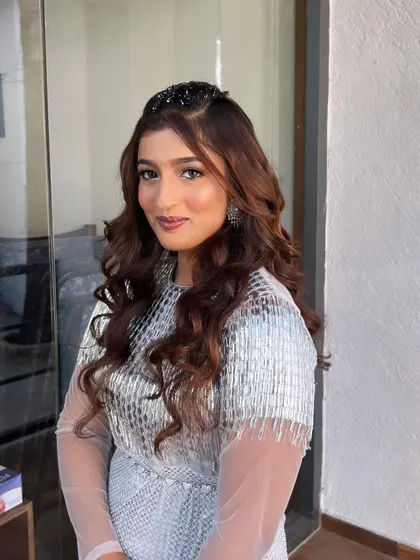 A modern princess look inspired by Tomorrowland. This bridal cocktail style is all about sparkle and shine, with crystal accents on the eyes and a glowing complexion.