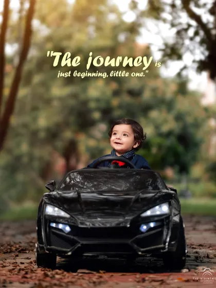 The journey is just beginning, little one. A forward-looking toddler at the wheel of his toy car, ready for the road ahead.