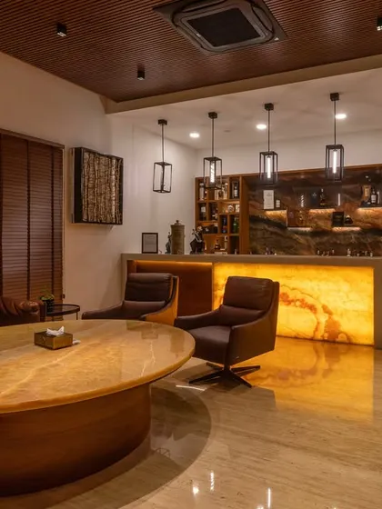 Another view of the home bar and lounge area, showing how it integrates into a larger entertainment space, perfect for hosting guests.