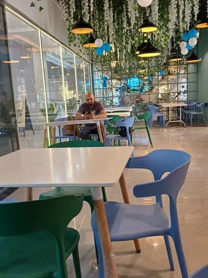 The clean and modern interior of our restaurant, with comfortable seating arrangements perfect for individuals and small groups.