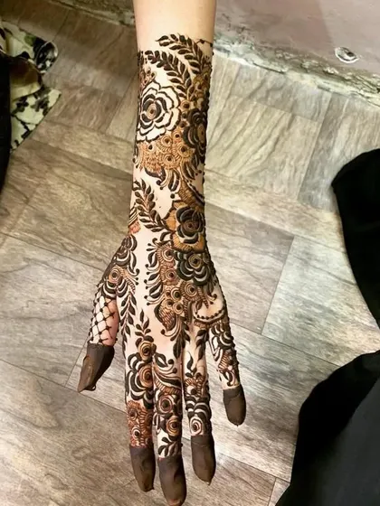 A full arm design with a beautiful flow, combining negative space with dense floral patterns.