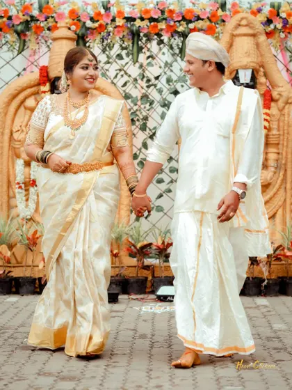 A full-length shot of the couple holding hands and walking together during their wedding ceremony, signifying the start of their journey.