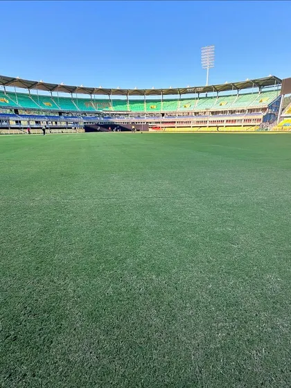 A beautiful, wide shot of the cricket ground. This is our canvas.