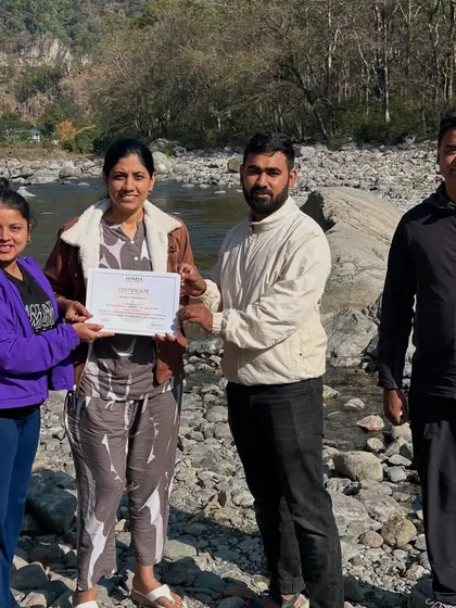 We believe in celebrating milestones. Here, a member of our tribe receives her retreat certificate, marking the culmination of days filled with yoga, self-discovery, and connection in the heart of the Himalayas.