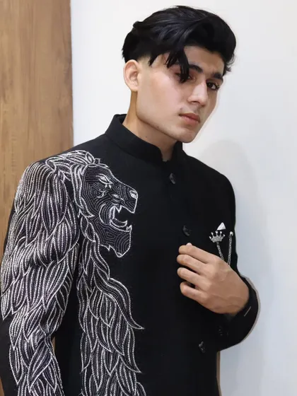 A direct, confident look in the custom lion bandhgala. This piece is a favorite among clients who want something that is both traditional in form and modern in spirit.