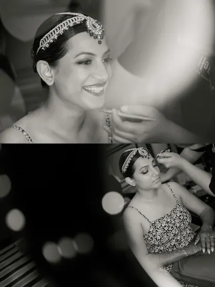 The bride's smile shines through as her makeup is applied. We use creative framing and bokeh to add an artistic touch to these getting-ready photos.