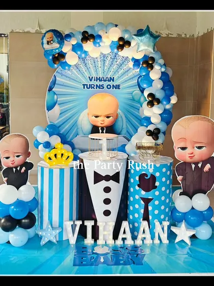 Vihaan's Boss Baby-themed first birthday featured a dynamic blue backdrop and character cutouts. I used striped and polka-dotted plinths, along with a crown prop, to celebrate the little boss in style.