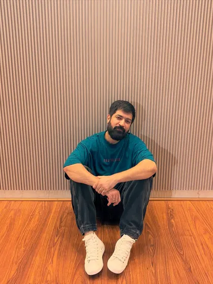 Sitting on the studio floor between shots. These quiet moments are filled with thoughts and inspiration.